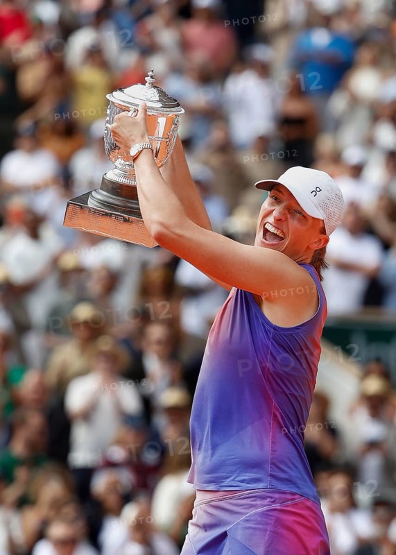 French Open 2024 Champion Iga Swiatek of Poland is holding the trophy at Roland Garros, Paris, France.