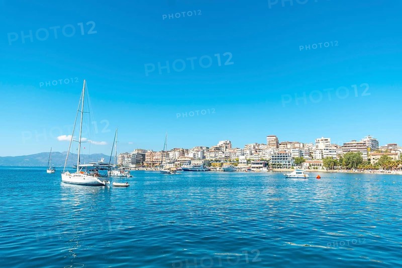 Tourist boats on the beaches of the city of Sarande or Saranda on the Albanian riviera seen from a boat, Albania, Europe