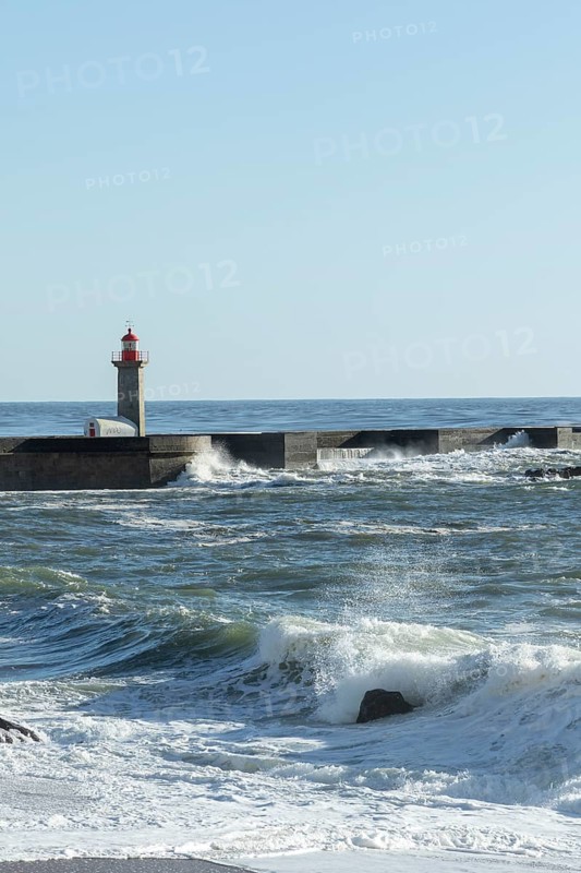 Farolim de Felgueiras lighthouse in the Atlantic Ocean and surf at Praia do Carneiro beach in Foz do Douro, Norte region, Porto district, Portugal, Europe