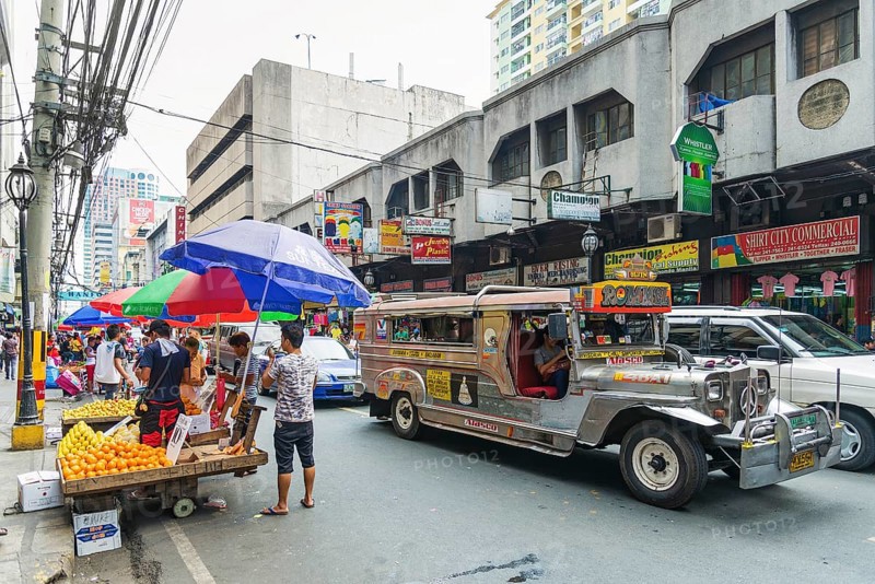 Local colourful jeepney bus in manila chinatown street in philippines