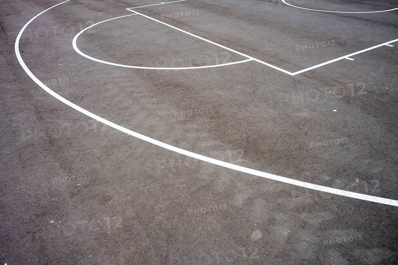 Basketball court lines on the asphalt