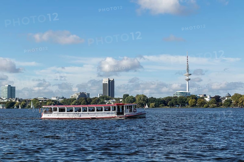Leisure activities in summer, pedal boats and Alster-Touristik launch Ammersbek in front of blue sky on the Alster, behind Hotel Radisson, The Fontenay and TV tower Telemichel, Hamburg, Germany, Europe
