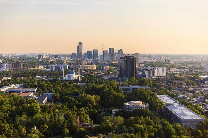 Top view from the observation deck on the Tashkent TV tower to the central part of the city covered with smog at sunset