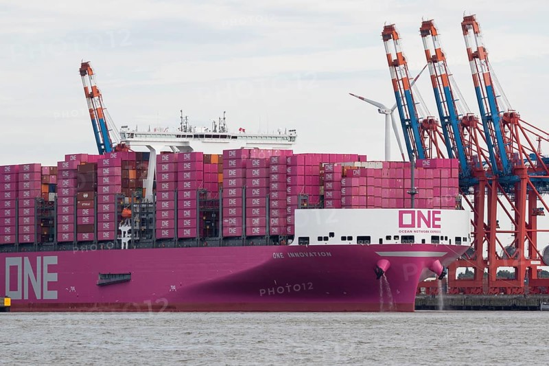 Pink container freighter One Innovation of the shipping company Ocean Network Express (Europe) Ltd. on the Elbe while mooring at Burchardkai in the Port of Hamburg of Hamburg, Germany, Europe