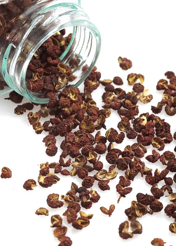 Szechuan pepper, Sichuan pepper, Japanese pepper, anise pepper, Chinese pepper, rhombic pepper, CZECHUAN OR SICHUAN PEPPER against a white background