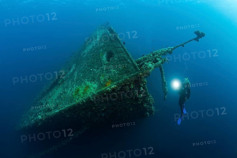 Divers on the wreck of the Umbria, Wingate Reef, Red Sea, Sudan, Africa