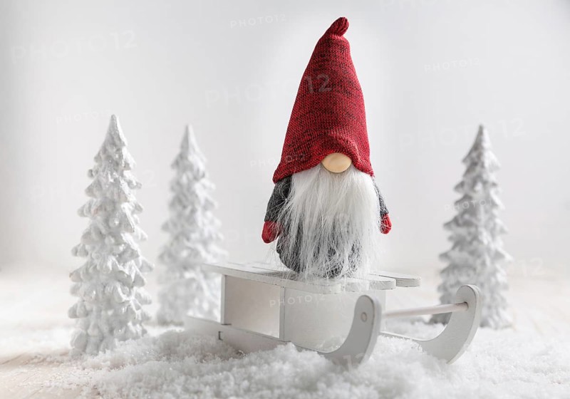 Christmas imp on sleigh with snowy landscape. Christmas decoration