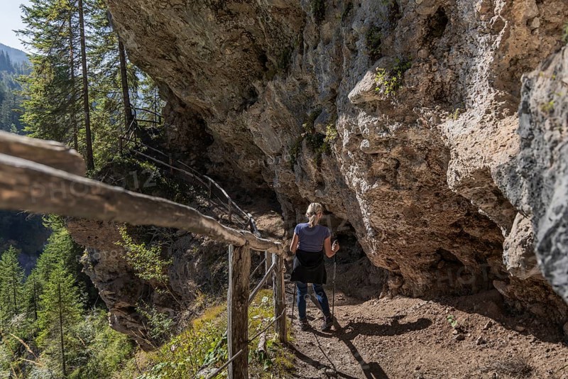 Alpine hiking trail on the rock to the Grotte' cave, vault, in Maria Alm, Salzburg