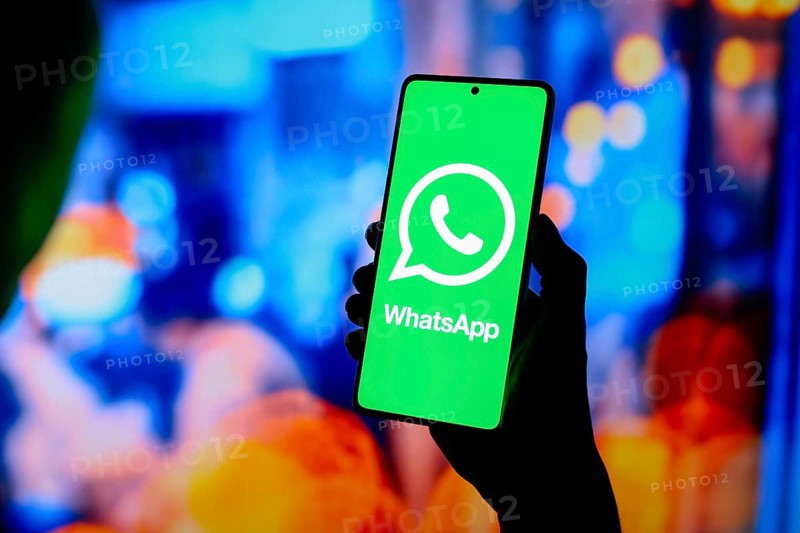 In this photo illustration, the WhatsApp logo is displayed on a smartphone screen