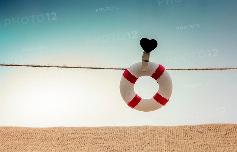 Life preserver attached to a string with heart icon