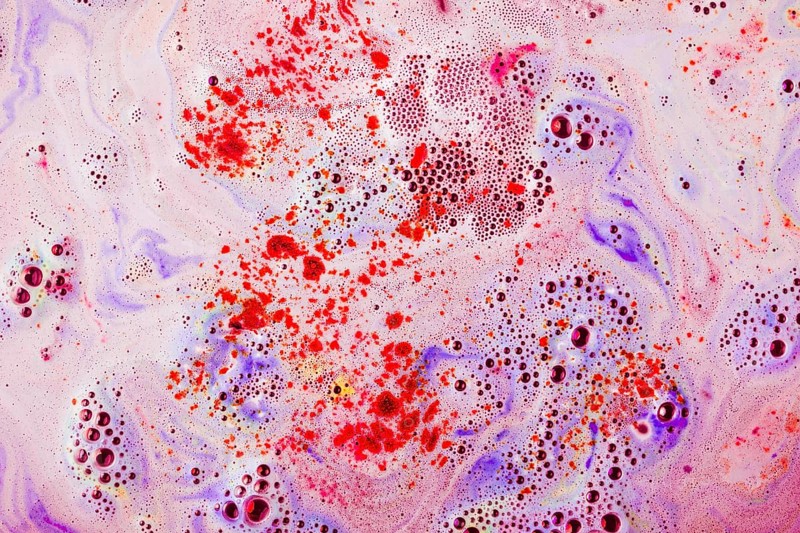 Red purple textured surface with dissolve bathbomb