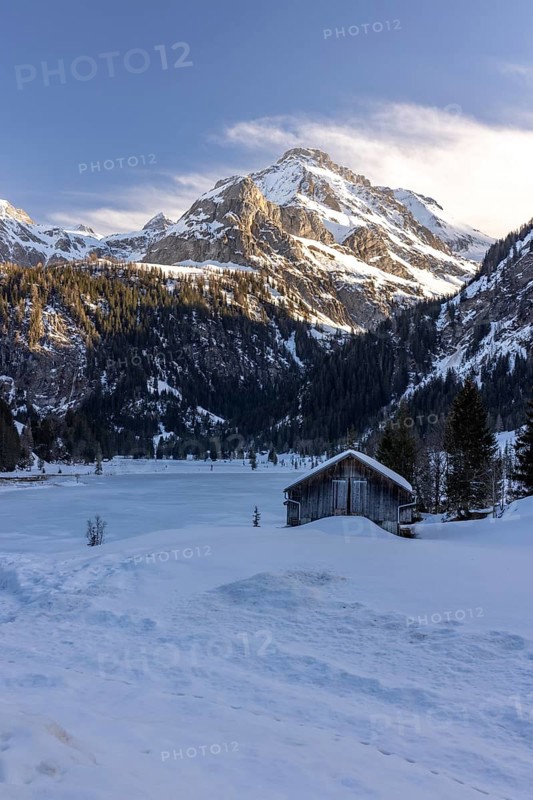 Frozen Lake Lauenen with a view of the Wildhorn and Arpelistock, Lauenen b. Gstaad, Bern, Switzerland, Europe