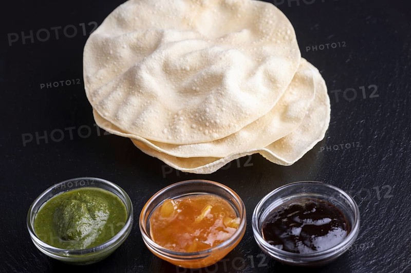 Papadam with various Indian sauces