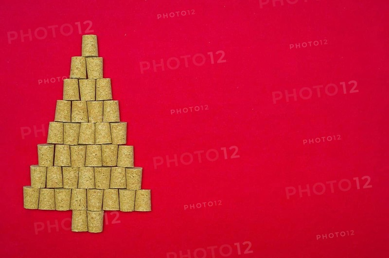 Background with christmas theme, christmas tree with wine corks on red background