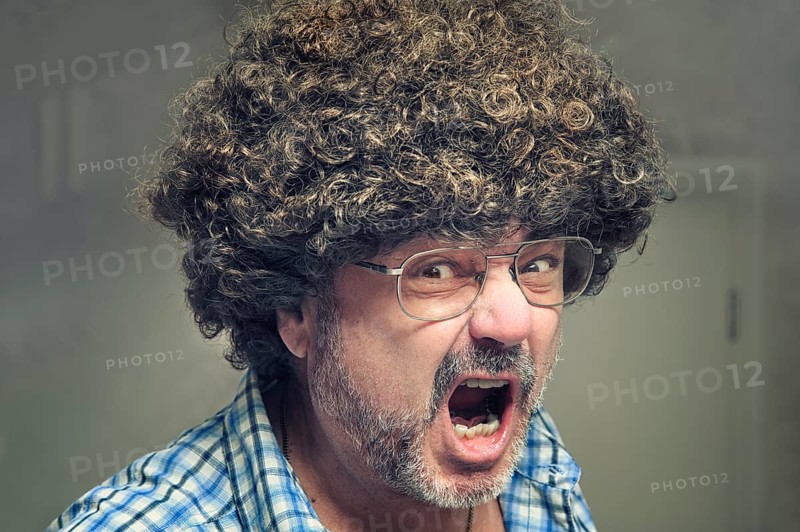 Angry pensioner with a wild wig