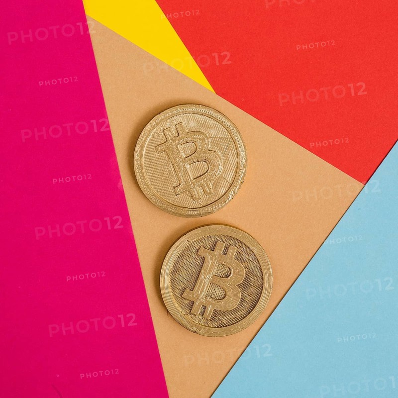 Two bitcoins many colorful background