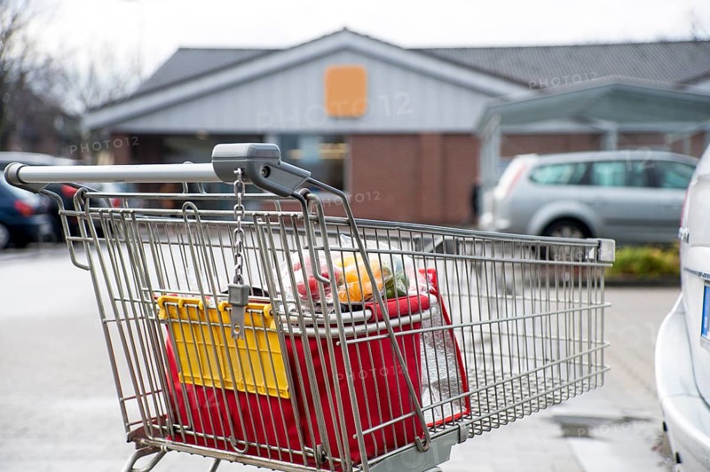 Shopping trolley in the car park of a discount store