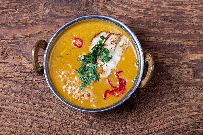 Indian mulligatawny soup in a bowl of brass