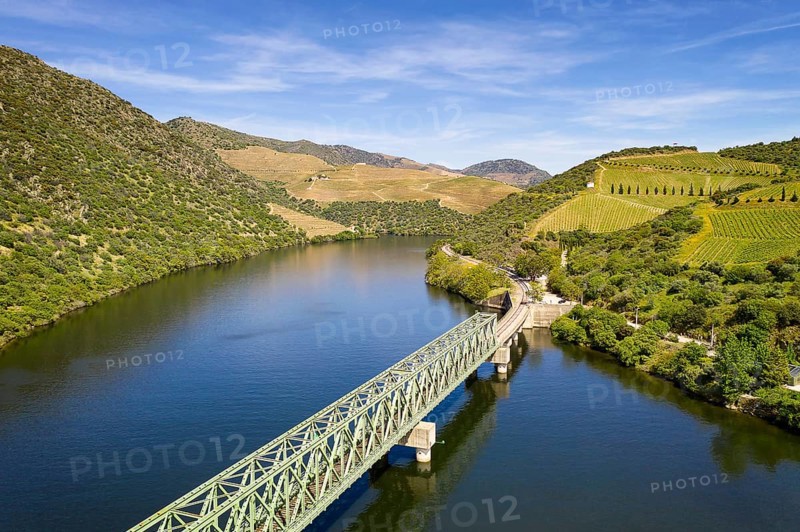 Douro railway bridge drone aerial view of river wine region in Ferradosa, Portugal, Europe