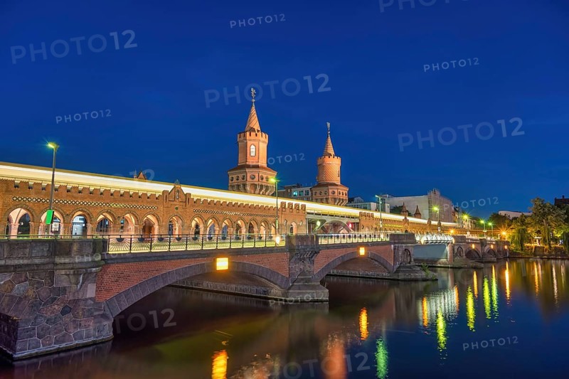 Berlin Germany, sunset city skyline at Oberbaum Bridge and Spree River