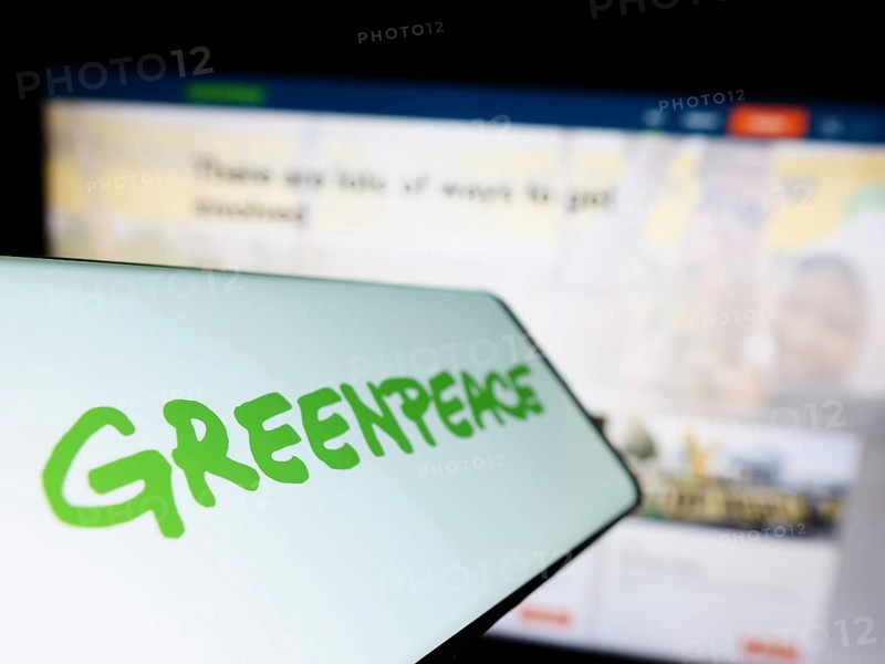 Stuttgart, Germany, 01-26-2023: Mobile phone with logo of environmental campaigning network Greenpeace on screen in front of website. Focus on left of phone display, Europe