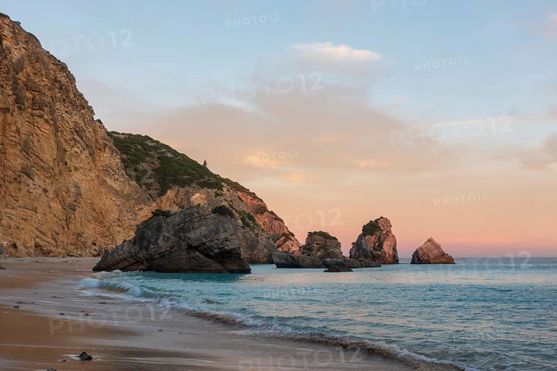 Ribeiro do Cavalo paradise beach in Arrabida Natural Park in Sesimbra at sunset, Portugal, Europe