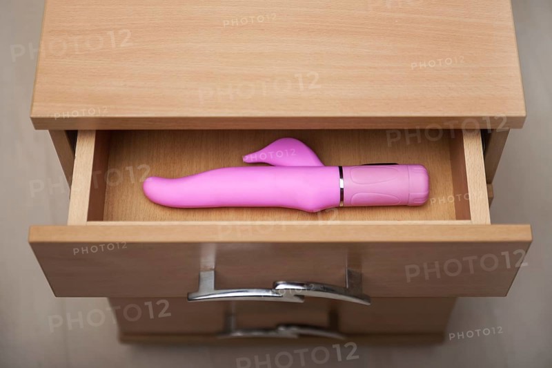 Sex toy in open countering bedside table