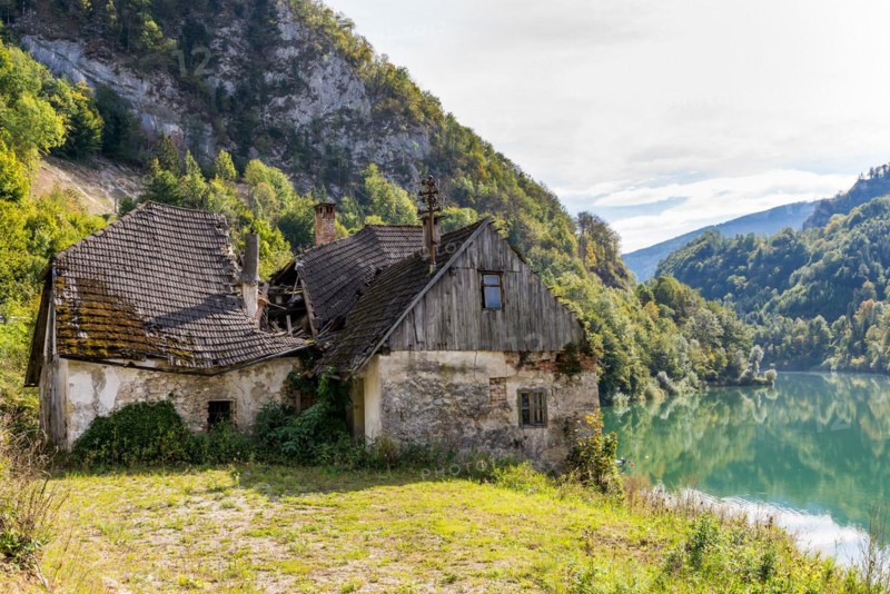 Deserted farm at the Enns river in Upper Austria. The roof is collapsed. The management of the farm is not worthwhile any more. Agriculture is furthermore a major economic factor in Austria