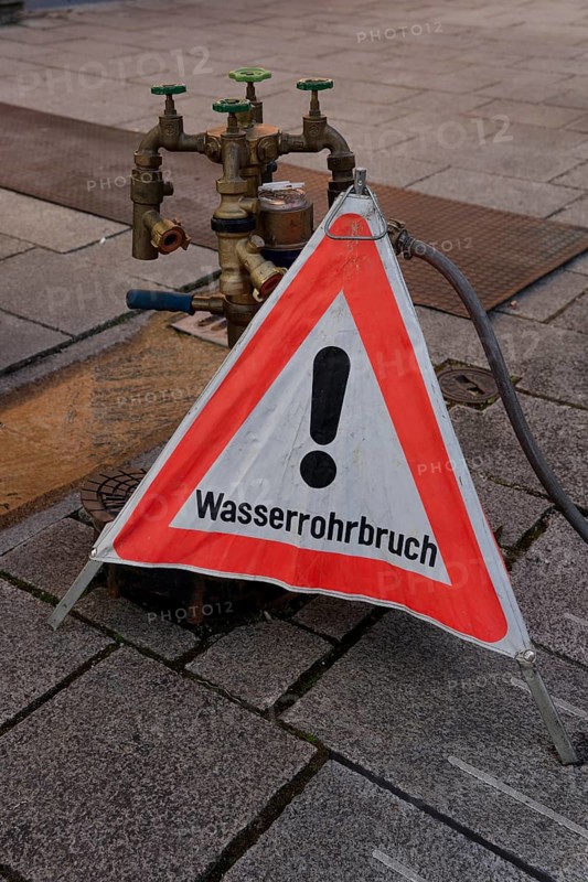Burst water pipe, damage, pipe, warning sign, notice, sign, attention, danger, water damage, Schrobenhausen, Upper Bavaria, Bavaria, Free State, Germany, Europe