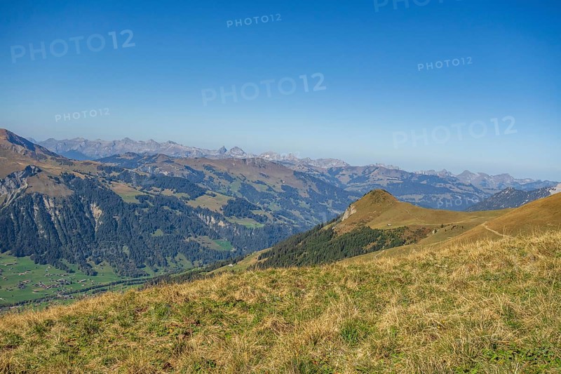 Landscape photograph of mountains and valleys in the Alps on a clear, sunny day, saas fee, graubünden, switzerland