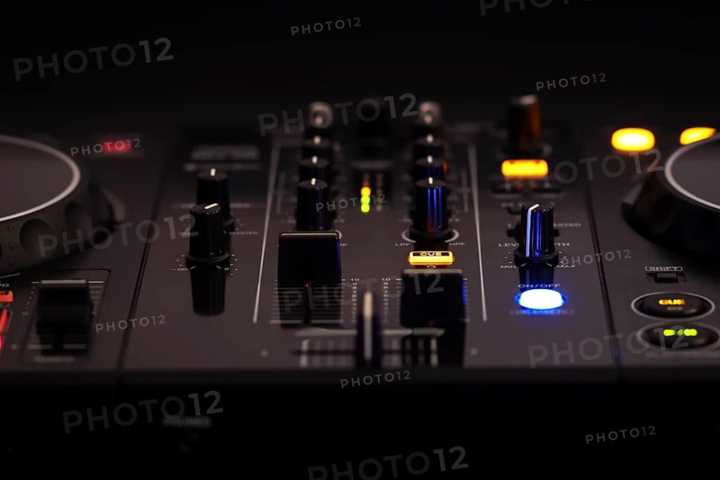 A black DJ mixer with various buttons and knobs, illuminated against a dark background, creating a professional and rhythmic ambiance, mixer dj audio