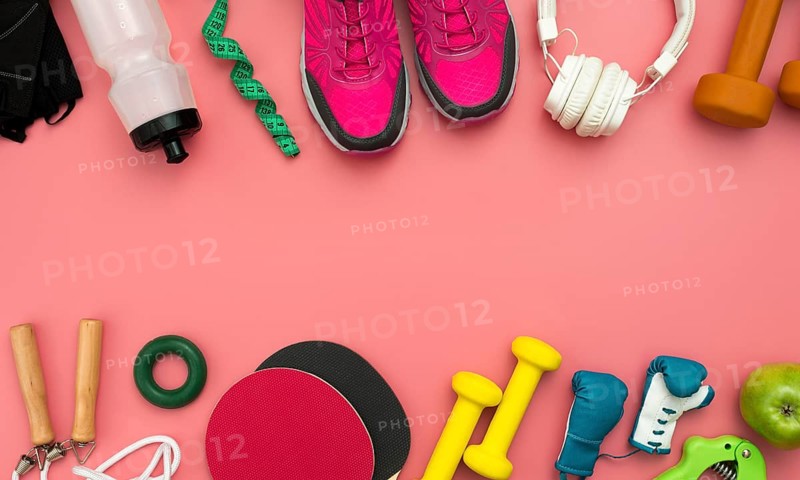 Flat lay sneakers with gym essentials