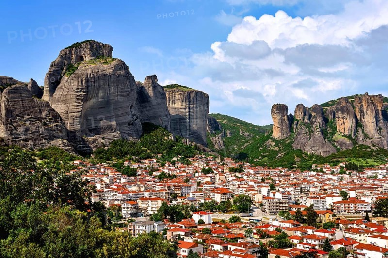 View of Kalampaka and Kastraki villages at foot of Meteora cliffs and pillars on sunny spring day. Greece, UNESCO World Heritage