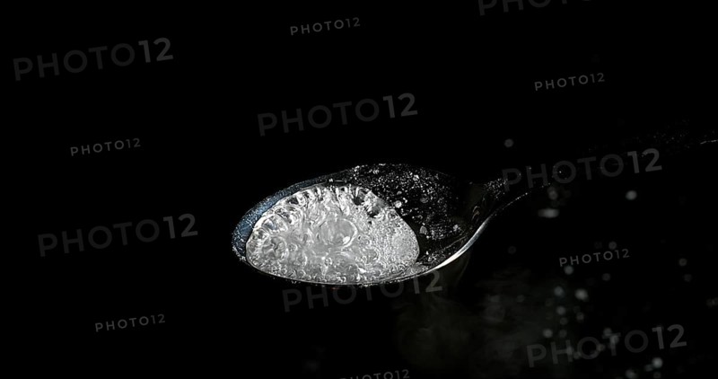 Drug, Cocaine in spoon against black background