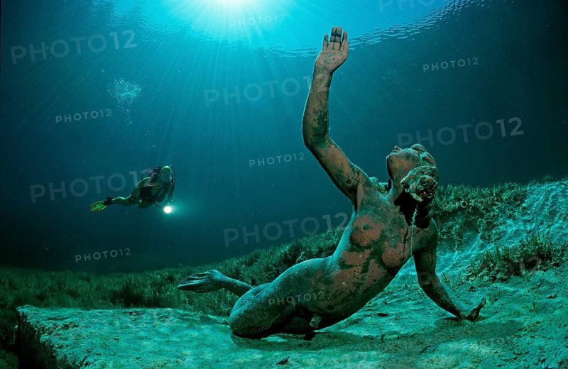 Diver in a mountain lake and King Ludwig mermaid, Germany, Bavaria, Europe