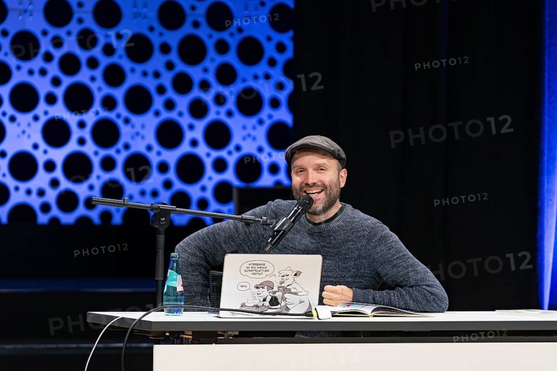 FRANKFURT AM MAIN, Germany, October 22 2023: Marc-Uwe Kling (*1982, German songwriter, author, and cabaret artist) reads at the 75th Frankfurt Book Fair, Europe