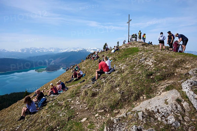 Many hikers take a break at the summit of the Jochberg, Walchensee, Upper Bavaria, Bavaria, Germany, Europe