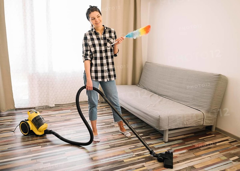 Woman vacuuming living room
