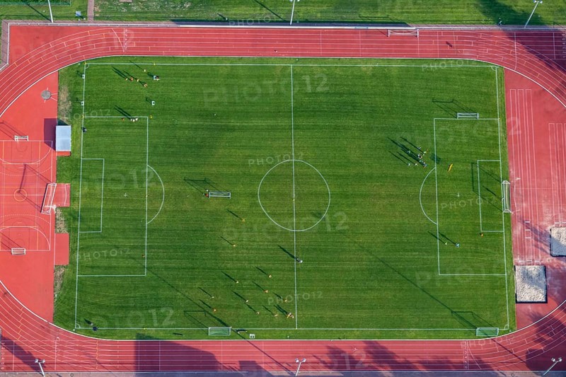 Aerial view at a soccer field with soccer players in Germany, Rhineland Palatinate near Bad Sobernheim
