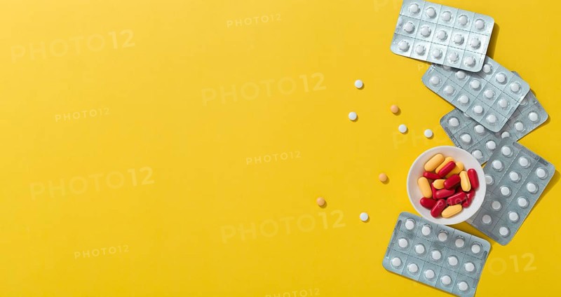 Flat lay pills with foils copy space