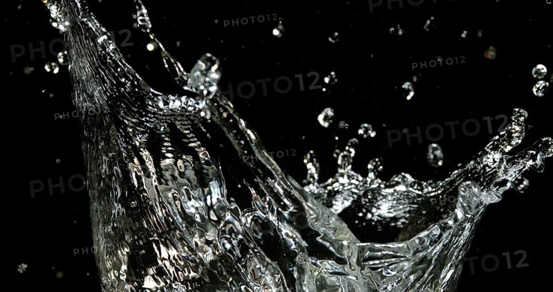 Water Exploding and Splashing against Black Background