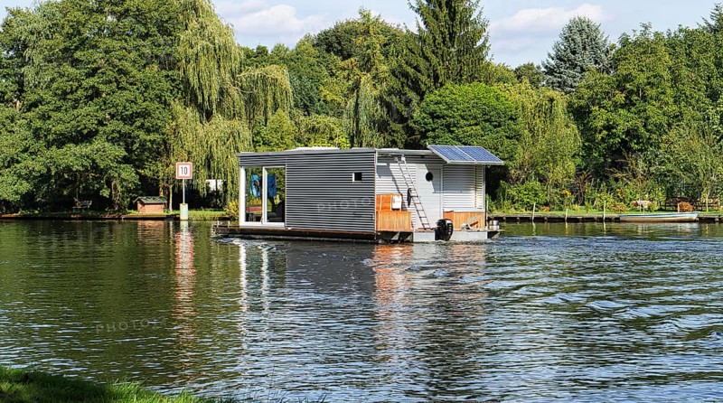 With the houseboat on the river Dahme in Brandenburg. relaxed sailing with the boat. discover nature and landscape