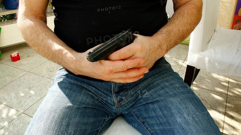 Hands holding a pistol