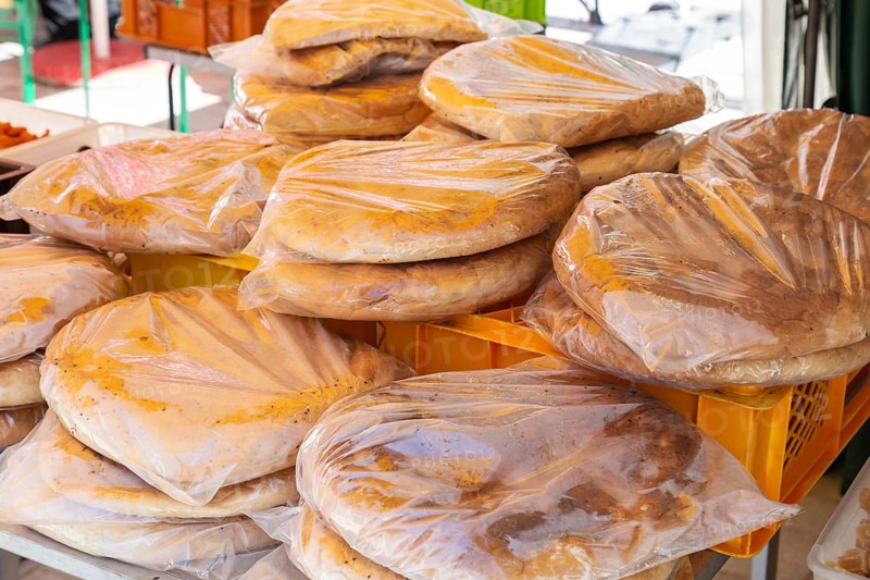 Packaged flatbreads for sale at a market stall