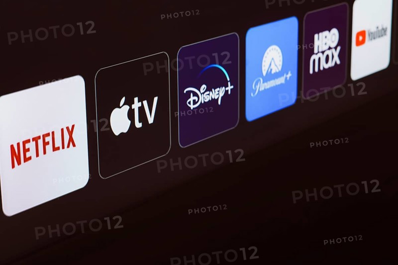 In this photo illustration the Netflix, Apple TV, Disney Plus, Paramount Plus, HBO Max and YouTube logo is displayed on a TV screen