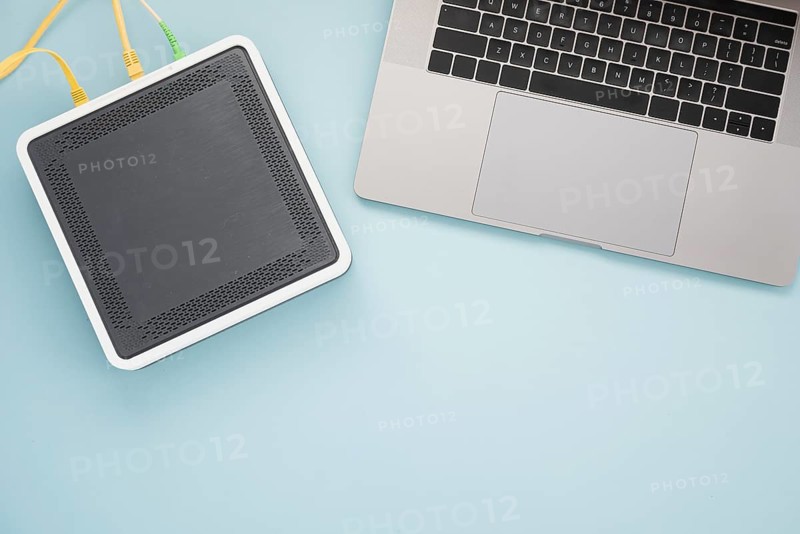 Flat lay desk with laptop wireless router