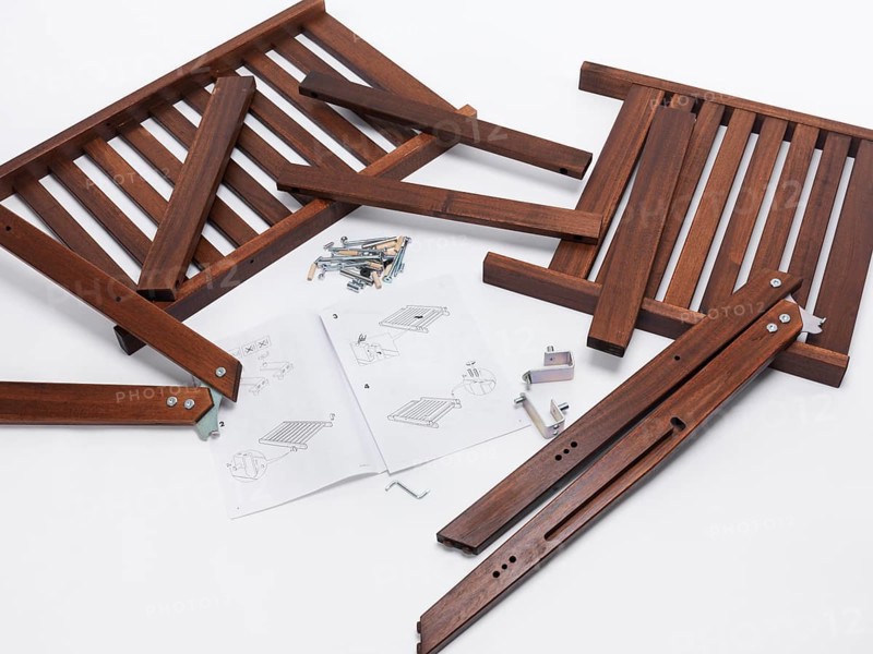 Assembling IKEA furniture parts with instructions