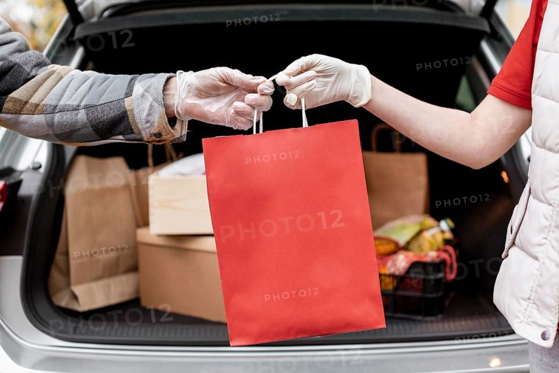 Close up hands holding paper bag