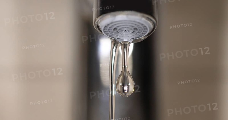 Water Flowing from the Tap, making a drop of water