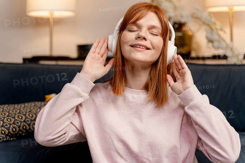 Portrait woman home listening music 6